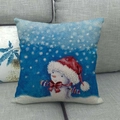 Detail of linen Christmas pillowcase featuring a snowman with hat on a grey sofa - Snowman with Christmas Hat Dark Blue Background Style (13)