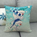Detailed close-up of linen pillowcase with blue cartoon snowman pattern on a gray sofa - Snowman with Pom-pom Hat Blue Tones Style (17)