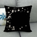 Black linen cushion cover with white star patterns on a grey fabric sofa - Black Silver Crescent Stars (12)