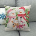Linen Christmas pillowcase featuring watercolor snowman family design on gray sofa - Watercolor Snowman Family Warm Style (7)