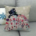 Detail of linen Christmas pillowcase showing a cute snowman family and snowflakes - Snowman Family
