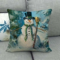 Christmas snowman print linen pillow cover with festive winter scene on gray sofa - Snowman with Broom and Cabin