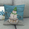 Detail of Christmas snowman linen pillowcase with JOY banner on a grey fabric sofa - 45x45cm / JOY Banner Snowman Style (11)