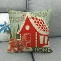 Christmas linen pillowcase with gingerbread men and red house design on grey sofa - 45x45cm / Gingerbread Men & Red House Style (7)