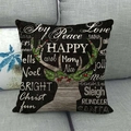 Close-up of linen Christmas pillow cover with reindeer silhouette and festive typography - Dark Wood Grain Reindeer Festive Words (10)