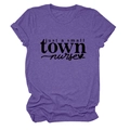 Close-up of purple t-shirt featuring just a small town nurse text and heart icon - Purple (Black Text)