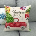 Detail of Christmas truck linen pillowcase on a grey sofa showing fabric texture - Red Pickup and Gift Boxes Style (7)