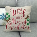Federa natalizia in lino con stampa We Woof You su un divano grigio chiaro - Tema Animali Natale (8)