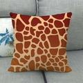 Macro detail of textured linen throw pillow case featuring orange giraffe pattern print - Brown Giraffe Pattern Style (6)