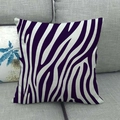 Close-up of square linen pillow cover with purple zebra stripes on a gray sofa - Purple Zebra Pattern Style (12)