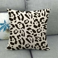 Macro detail of natural linen pillowcase texture featuring black leopard pattern on a sofa - Leopard Print Style (15)