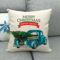 Linen Christmas pillowcase with vintage blue truck and green tree on grey sofa - Blue Truck with Wreath Decor