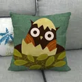 Close-up of linen fabric texture featuring a cartoon owl pattern on a green cushion - Dark Green Owl Hatching Style (26)