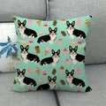 Detail eines Kissenbezugs aus Leinen mit Corgi- und Eismuster auf grauem Sofa - Minzgrüner Corgi Eis Stil (13)