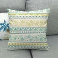 Macro shot of pineapple pattern linen cushion cover on a grey sofa for home decor - Green White Ethnic Pineapple Style (5)