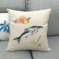 Close-up of linen pillowcase with watercolor fish and lemon print on gray sofa - Fish and Fillet Hand-drawn (14)