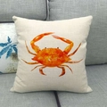 Detail of linen cushion cover featuring orange watercolor crab on a gray sofa - Orange Crab Watercolor (16)