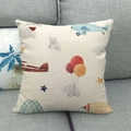 Detail of linen pillowcase with plane and elephant illustration on gray sofa - Elephant and Plane Style (10)