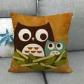 Linen decorative pillowcase with cartoon owls nest illustration on a grey sofa - Vintage Warm Orange Double Owl Style (24)