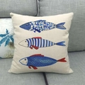 Linen ocean fish pattern square throw pillow cover on a grey sofa for home decor - Three Stylized Fish (8)
