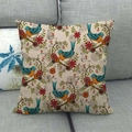 Vintage Kissenhülle aus Leinen mit Vogelmuster auf einem grauen Stoffsofa - Blaugrüne Vögel Und Blumen (1)