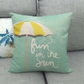 Close-up of linen cushion cover featuring mint green fabric and sun umbrella pattern - Mint Green Umbrella Fun in the Sun Style (9)