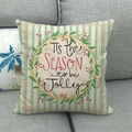 Detail of linen texture and festive 'Tis the Season to be Jolly' lettering on Christmas pillow - Red Green Christmas Wreath Holiday Style (16)