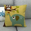 Mustard yellow linen cushion cover with cartoon owl and elephant on a grey sofa - Ginger Yellow Owl Elephant Trunk Style (14)