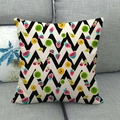 Detailed texture of linen cushion cover featuring colorful cartoon fruit patterns on a sofa - B&W Chevron Cartoon Fruit