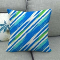 Geometric linen pillow cover with blue and green hand-painted stripes on grey sofa - Blue Green White Diagonal Stripes (1)
