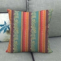 Colorful geometric linen pillowcase with ethnic patterns on a gray sofa - Bohemian Ethnic Style Vertical Stripes