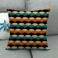 Linen pillow cover with orange and dark green geometric fan patterns on a grey sofa - Retro Geometric Colorblock Fish Scale