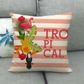 Tropical flamingo and pineapple pattern linen pillowcase on a grey sofa cushion - Pale Orange Stripe Tropical Animal