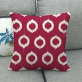 Close-up of geometric white tie-dye ring pattern on a red linen throw pillow cover - Pure Red White Ikat Circle (11)
