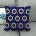 Linen decorative pillowcase featuring navy blue ikat geometric patterns on a grey sofa - Deep Blue Green Red Ethnic (13)