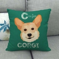 Linen pillowcase featuring a cartoon Corgi illustration on a grey sofa - Green C is for Corgi (10)
