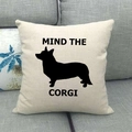 Linen cushion cover with black Corgi silhouette and Mind the Corgi text on gray sofa - Mind the Corgi Style (12)