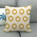 Linen decorative pillow cover with yellow geometric ikat circle patterns on a sofa - Beige Yellow Ikat Circle (5)
