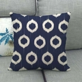 Square linen throw pillow cover with navy blue ikat circle patterns on a grey sofa - Deep Blue Beige Ikat Circle (8)