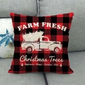 Christmas buffalo plaid pillow cover with red truck design on a grey sofa - Red Black Plaid Vintage Truck Style