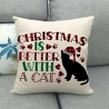 Housse de coussin Noël chat noir et bonnet à carreaux rouges sur canapé gris - 45x45cm / Style Chat Noir avec Bonnet à Carreaux