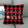 Fodera per cuscino natalizio a quadri rossi e neri con silhouette di renne su divano - Stile Slitta di Babbo Natale e Fiocchi di Neve (5) / 45x45cm
