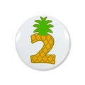 Macro view of a pineapple-themed number 2 badge made of glossy tinplate material - Pineapple Number 2