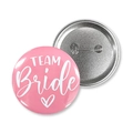 Front and back detail of pink Team Bride tinplate badges with metal safety pin design - 58mm / Team Bride Style / Pink