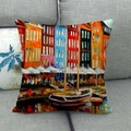 Close-up of linen cushion cover with colorful oil painting harbor print on a grey sofa - Harbor Sailboat Style (14)
