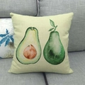 Macro shot of linen pillowcase with watercolor avocado print on a grey fabric sofa - Beige Simple Avocado Style (6)