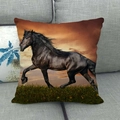 Square linen pillow cover featuring a running horse at sunset on a gray sofa - Black Horse Sunset Grass(3)