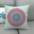 Close-up of square linen pillowcase with colorful mandala geometric print on a grey sofa - Pale Teal Bohemian (8)
