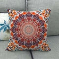 Linen style pillow cover with orange and blue mandala pattern on grey fabric sofa - Orange Blue Symmetrical Texture (15)