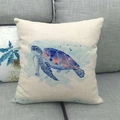 Macro detail of a square linen cushion cover featuring a watercolor turtle print on a sofa - Blue Purple Gradient Watercolor Turtle (17)